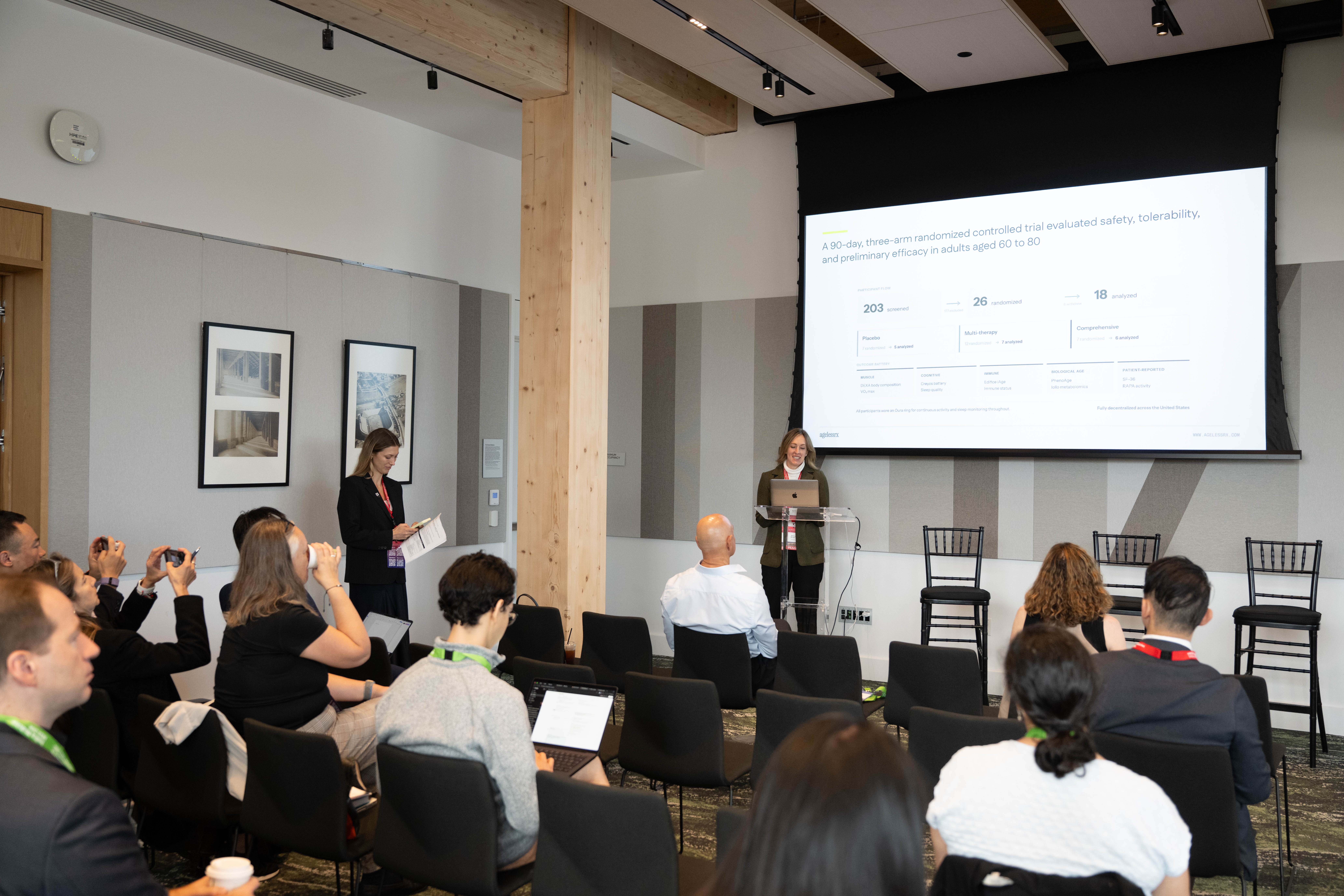 A wide Cedar Grove workshop view with the AgelessRx presentation on screen and attendees taking notes and photographs.